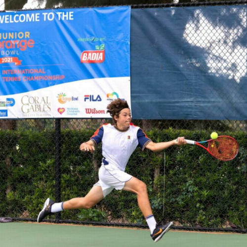 Alejandro Arcila playing tennis, mid-swing