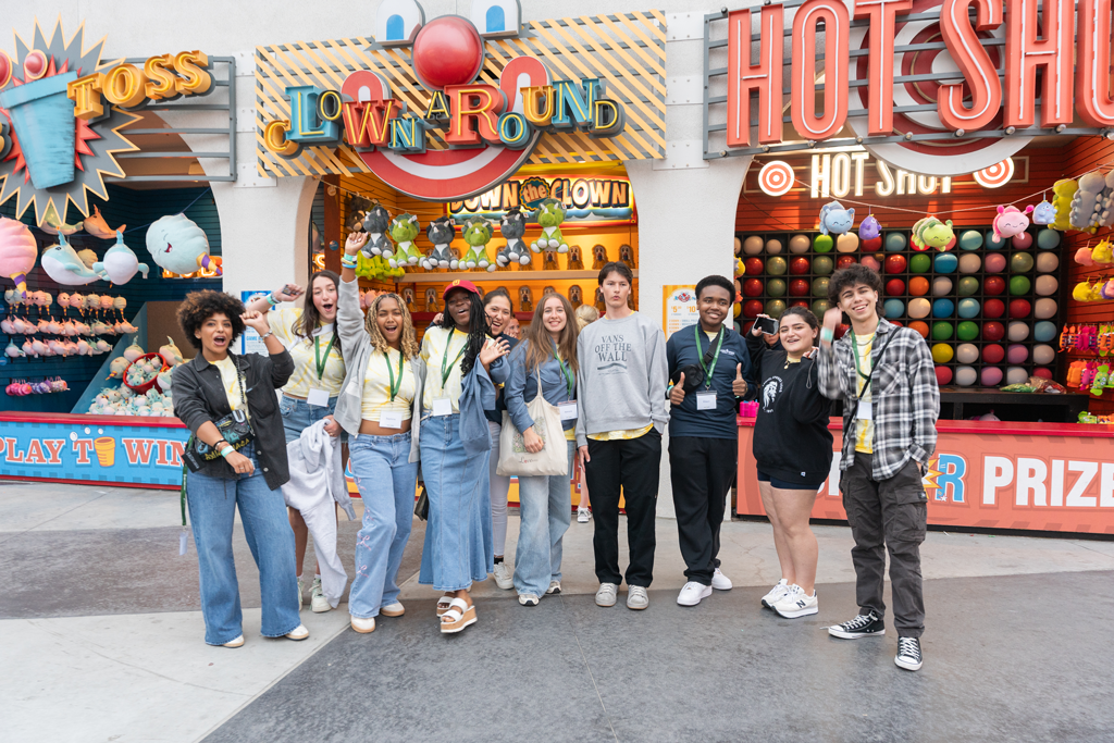 Seniors celebrating at Belmont Park amusement park during grad night festivities