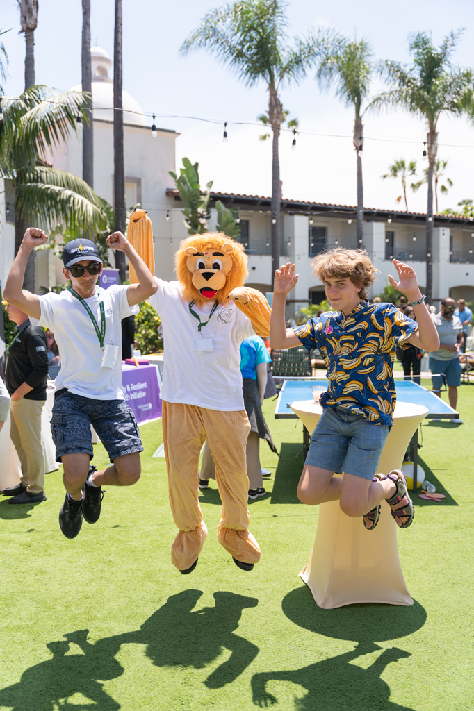 YEC Community Fair showing families and students enjoying games, activities and booths